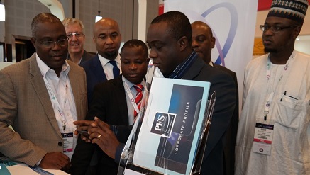 Yele Okeremi, MD/CEO, Precise Financial Systems [PFS], [middle] demonstrates how the iTeller Mobile Cheque Truncations works while Philips Ayeni, deputy MD, PFS, (left), Prof. Sola Aderonmu, president, Nigeria Computer Society [NCS] [second left) and Dr. Isa Ali Ibrahim (Pantami), director general, National Information Technology Development Agency [NITDA] pay attention at the launch ceremony at GITEX 2016 in Dubai on Monday.